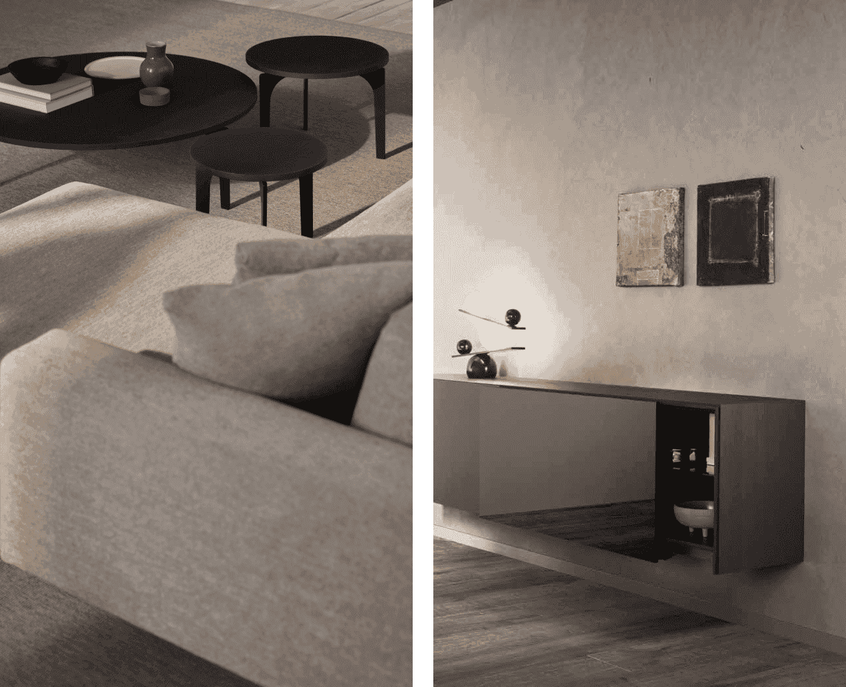 Composición de interior moderno con sofá en tonos neutros y mesas auxiliares negras, junto a un aparador suspendido minimalista sobre pared texturizada con decoración sobria y cuadros abstractos.